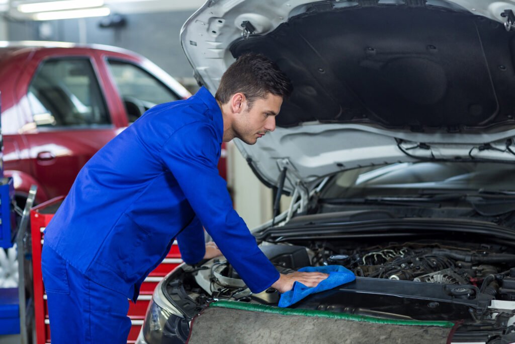 A professional detecting need for car battery replacement